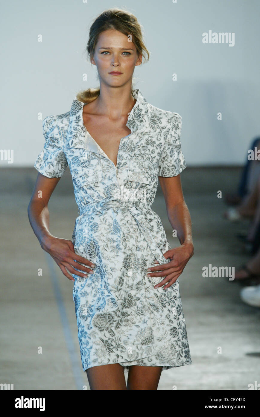 Backstage Milan Spring Summer Prada Model Carmen Kass long stright blonde  hair brown roots, pale pinkmatt lipstick, looking to Stock Photo - Alamy