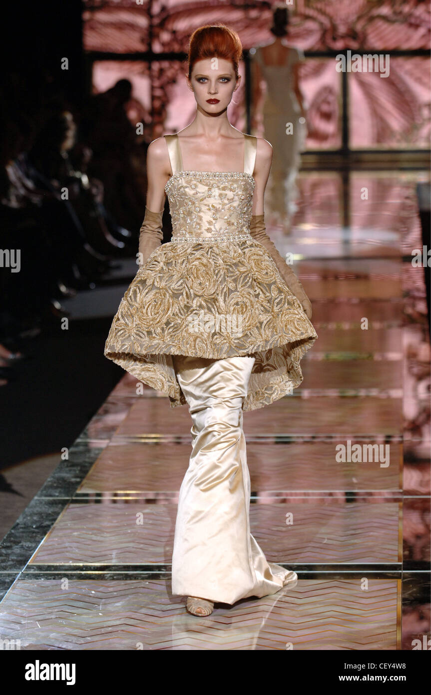 Valentino Paris Haute Couture Autumn Winter Red hair female model wearing a  champagne coloured brocade satin dress brocade top Stock Photo - Alamy