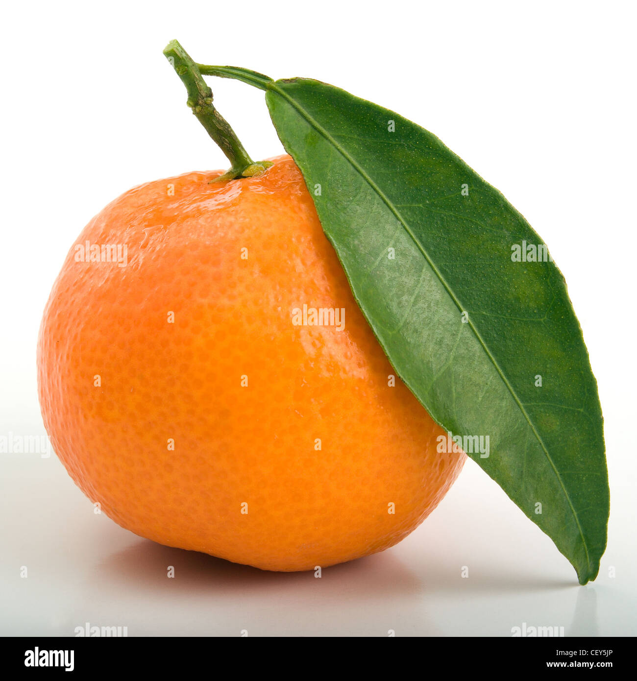 Mandarin with a green leaf Stock Photo