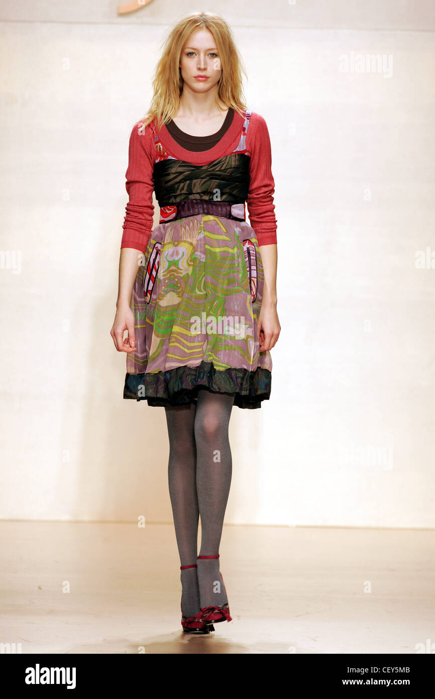 Byblos Milan Ready to Wear Autumn Winter Multi fabric printed babydoll dress  and ankle strap shoes Stock Photo