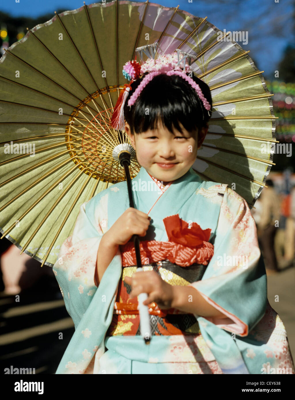Japan Local girl in traditional costume holding umbrella Stock Photo