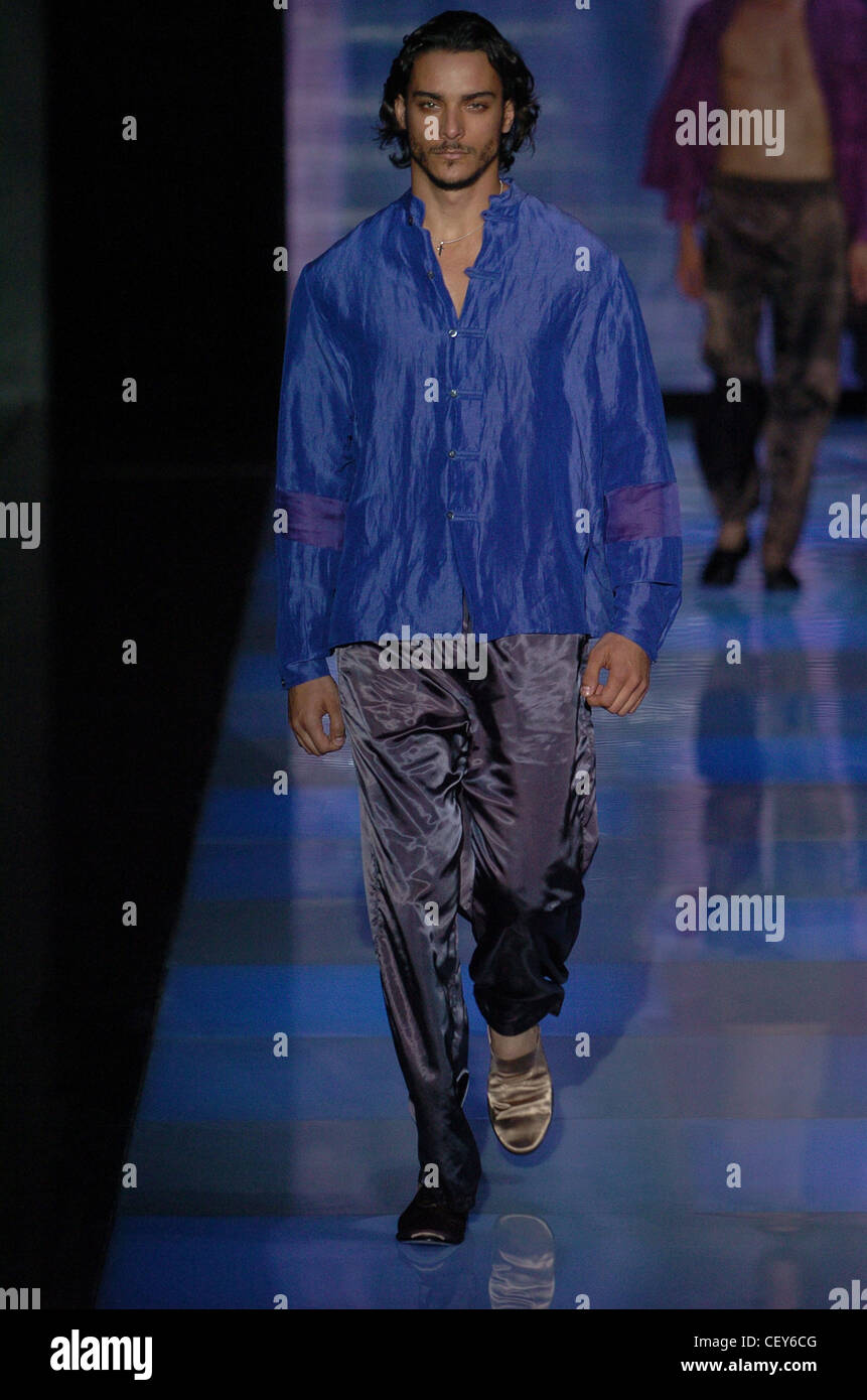 Giorgio Armani Milan Menswear S S Ethnic look: male wearing blue scrunched  silk long sleeved shirt purple satin trousers Male Stock Photo - Alamy