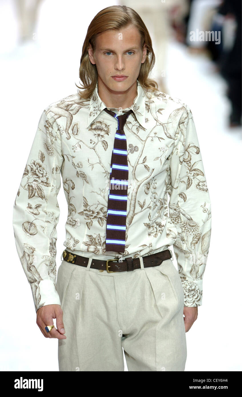 Paul Smith Paris Menswear S S Male model wearing beige floral patterned  shirt and beige trousers with black striped tie Stock Photo - Alamy