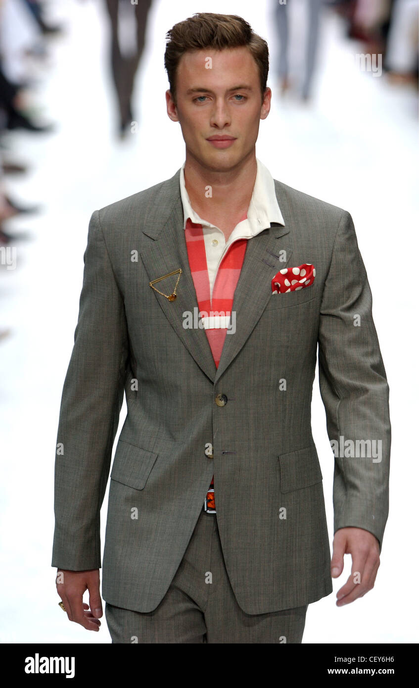 Paul Smith Paris Menswear S S Male model wearing grey suit and red shirt  with spotted red handkerchief Stock Photo - Alamy