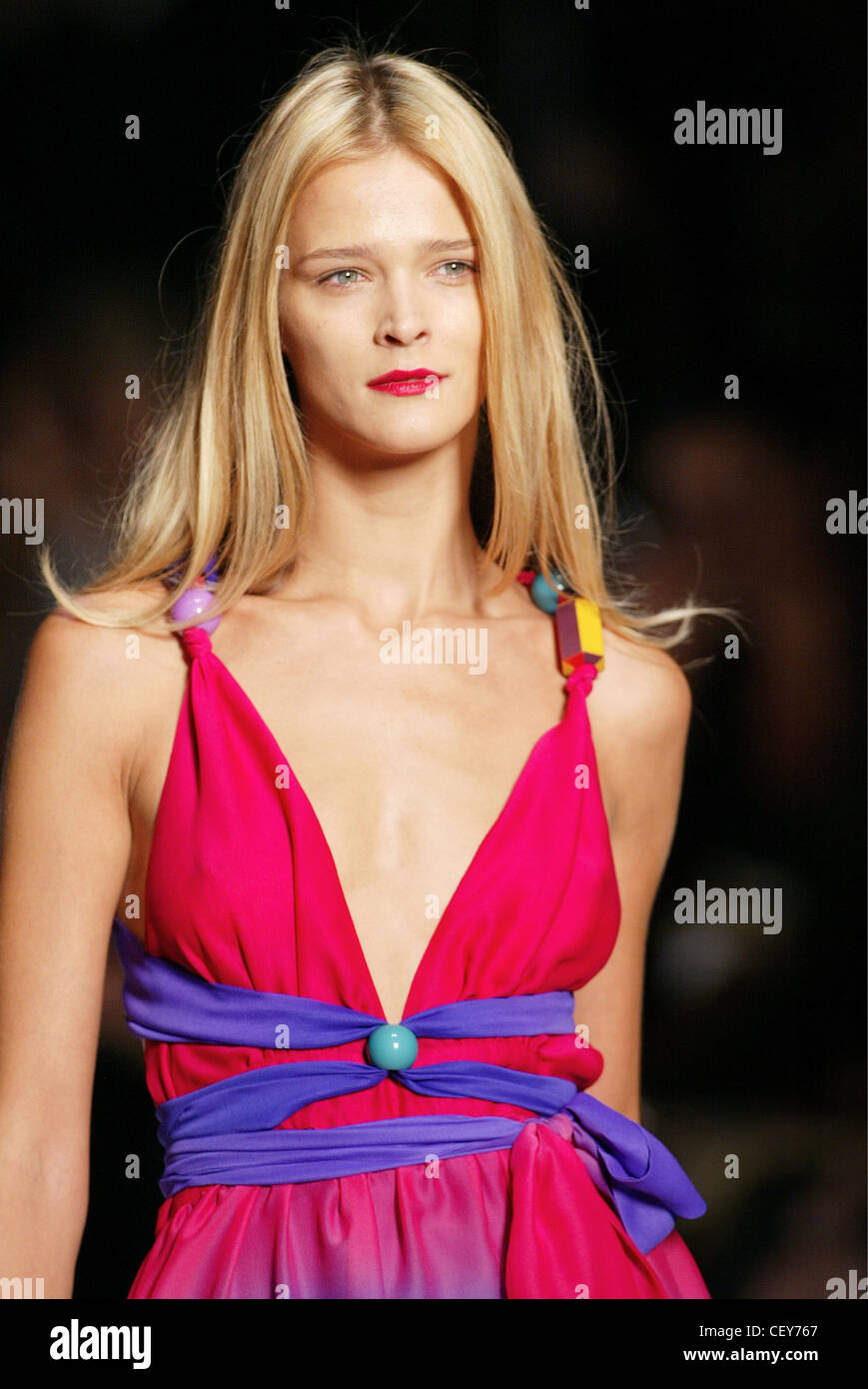 Backstage Milan Spring Summer Prada Model Carmen Kass long stright blonde  hair brown roots, pale pinkmatt lipstick, looking to Stock Photo - Alamy