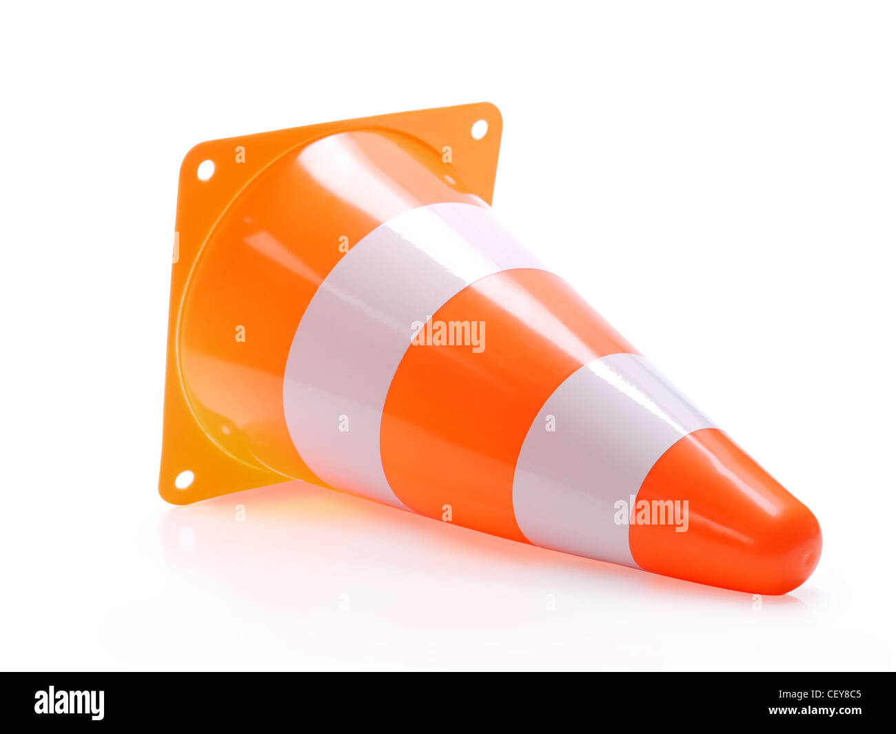 Fallen road warning cone shot on white background Stock Photo
