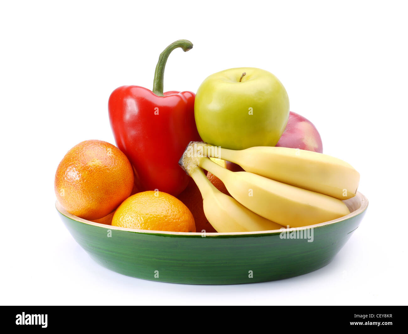 Plate of fresh fruits and vegetables shot on white Stock Photo