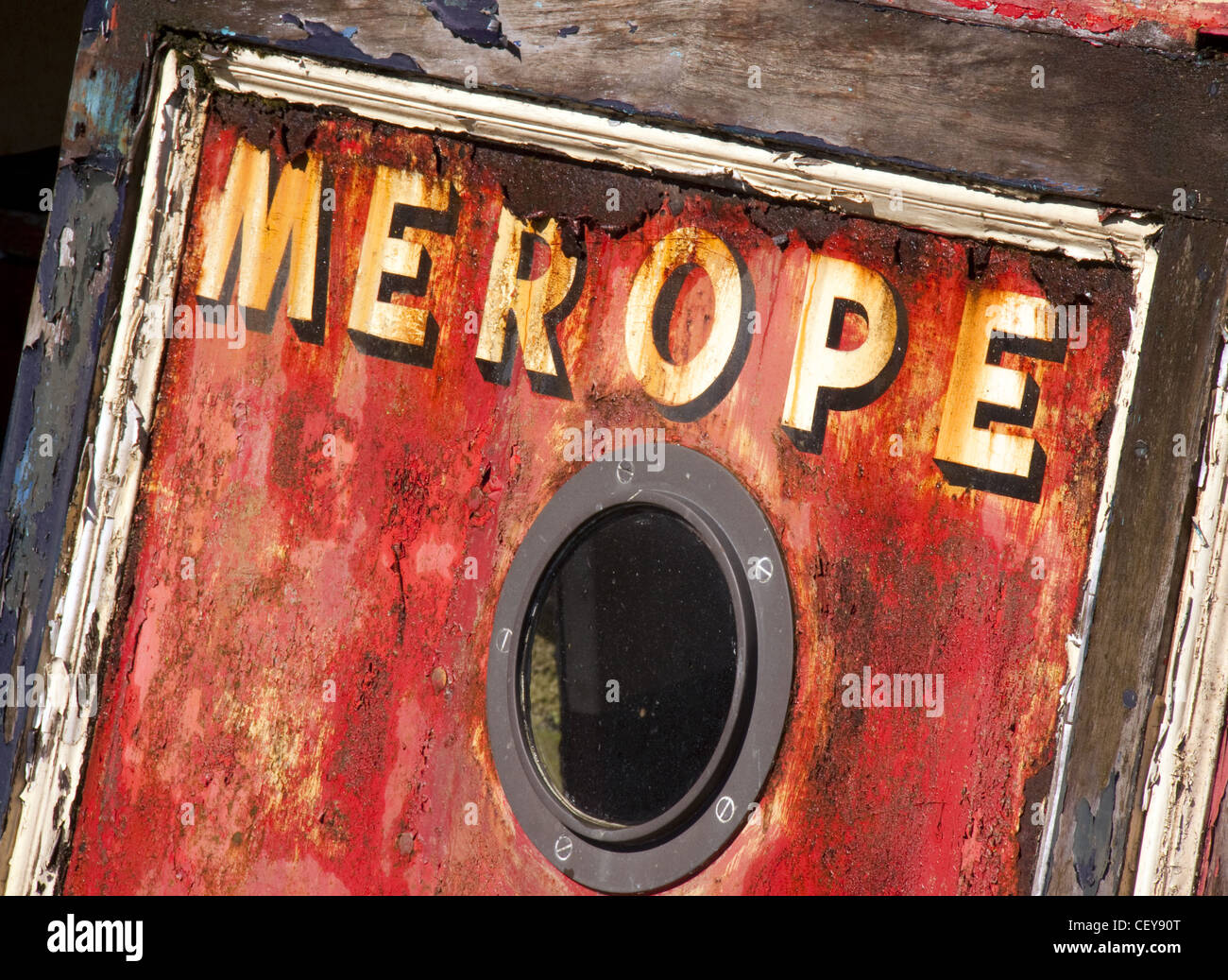 Merope, a decaying British canal boat in red Stock Photo