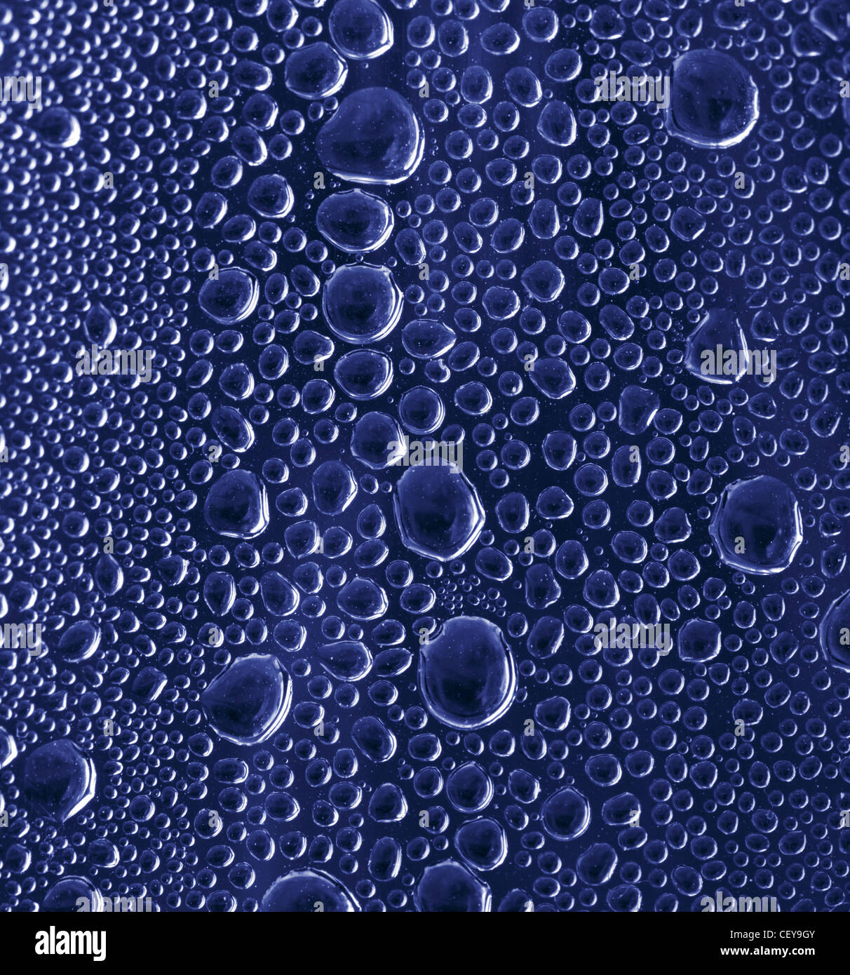 Blue water drops on glass background Stock Photo - Alamy
