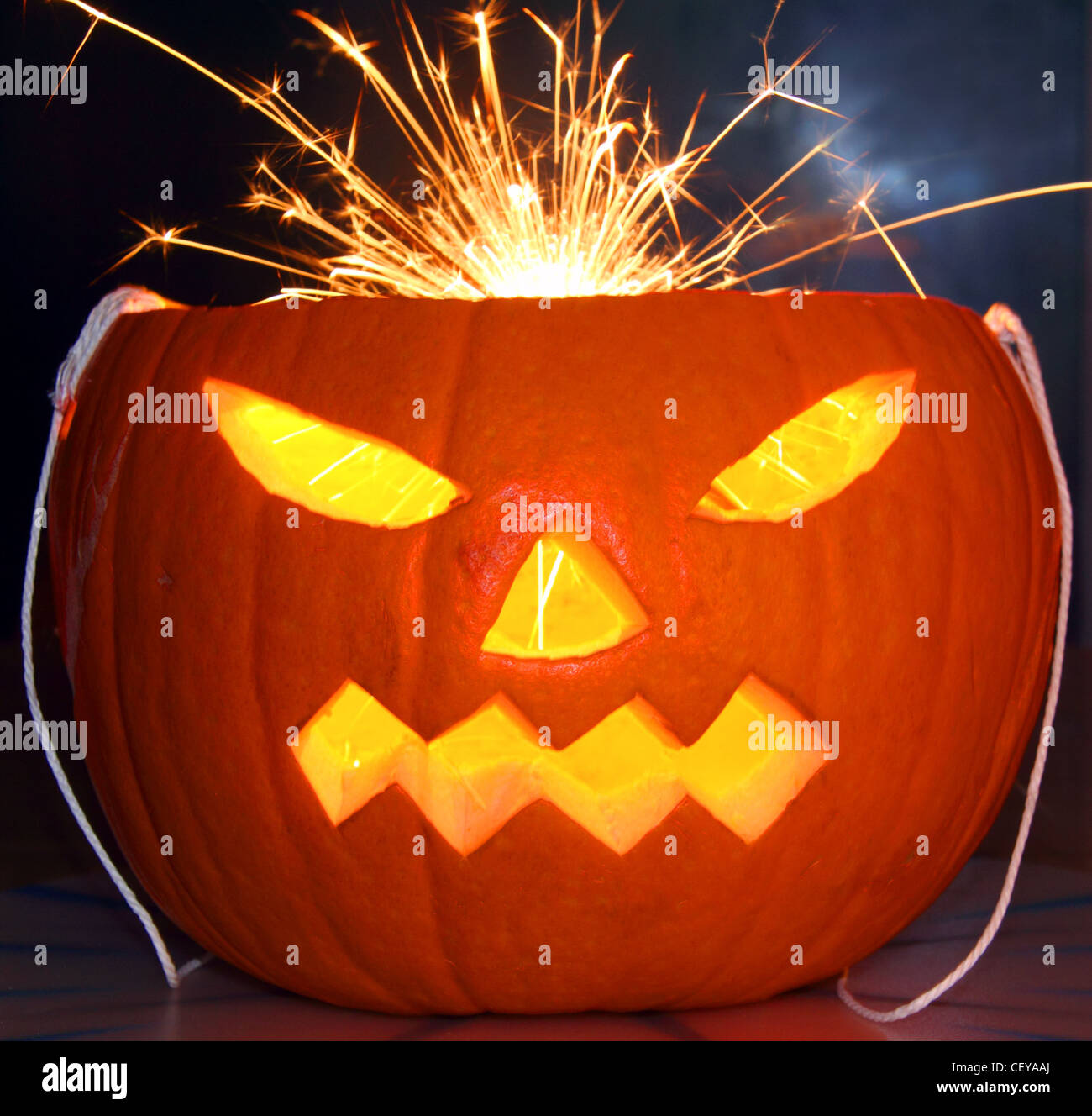 Orange Halloween Pumpkin with a sparkler for hair Stock Photo