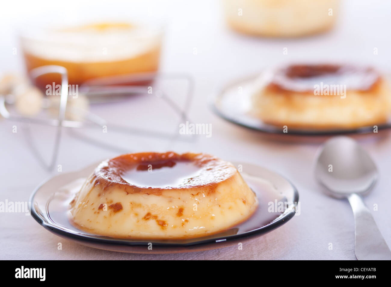 Flan: Sweet custard with a caramel topping. Pudding. Vanilla flavour.  Caramel, known as 'flan' in the US and Spanish. Stock Photo