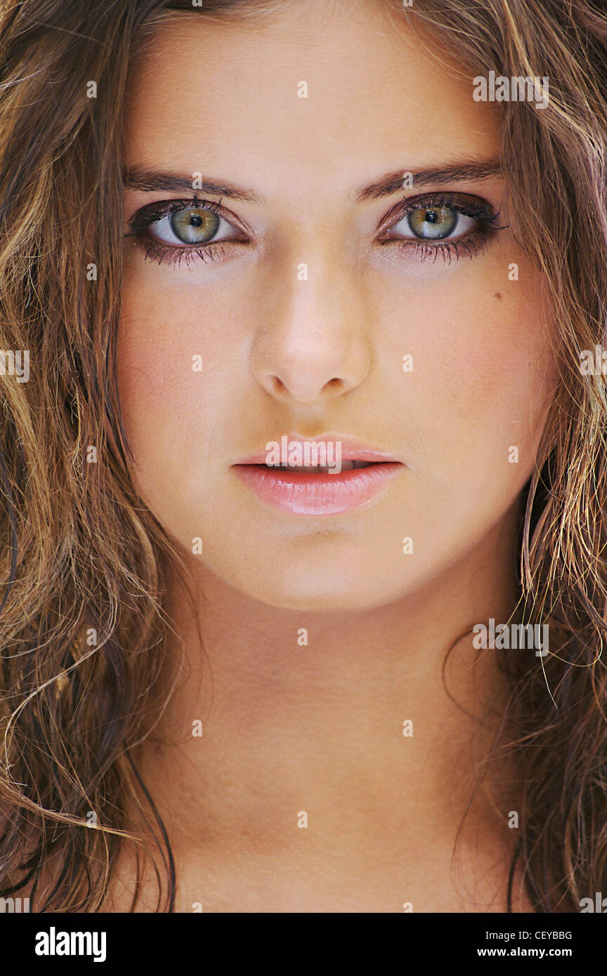 Cropped Image Of Brunette Female With Shoulder Length Wavy Hair