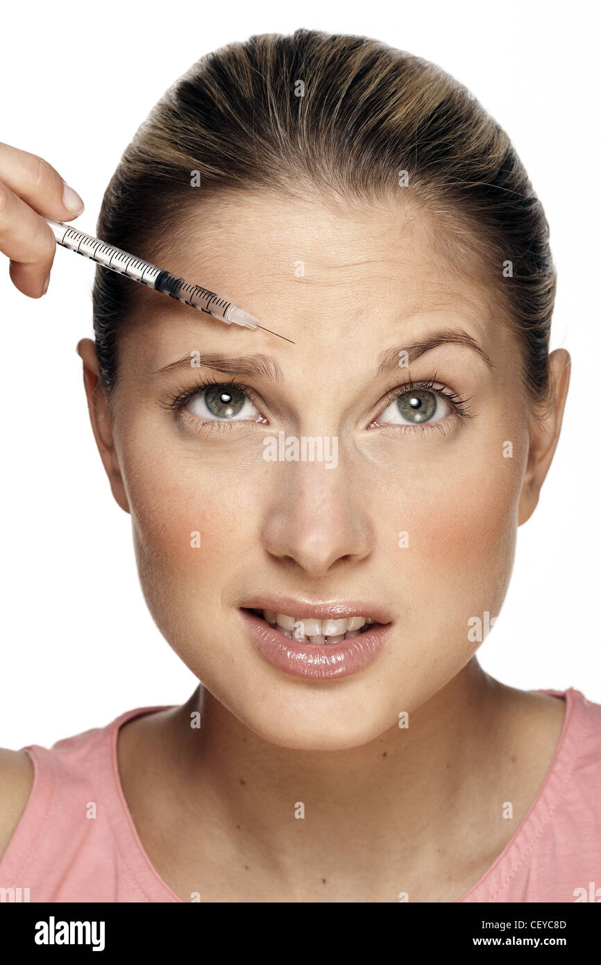 Female having botox injection on forehead Stock Photo Alamy