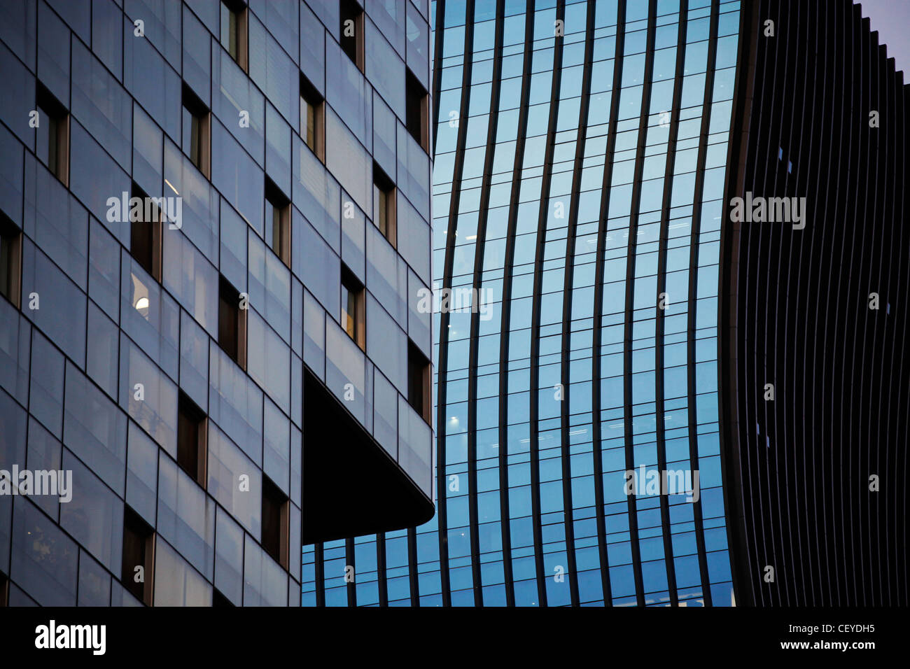 Lines and windows of office block buildings at sunset with lights in the Gangnam district of Seoul, South Korea Stock Photo