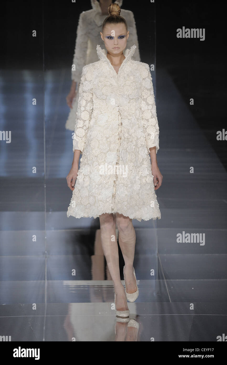 Valentino Paris Haute Couture Spring Summer Tight updo hair, cream lace  frock coat and dress, with beaded shoes Stock Photo - Alamy