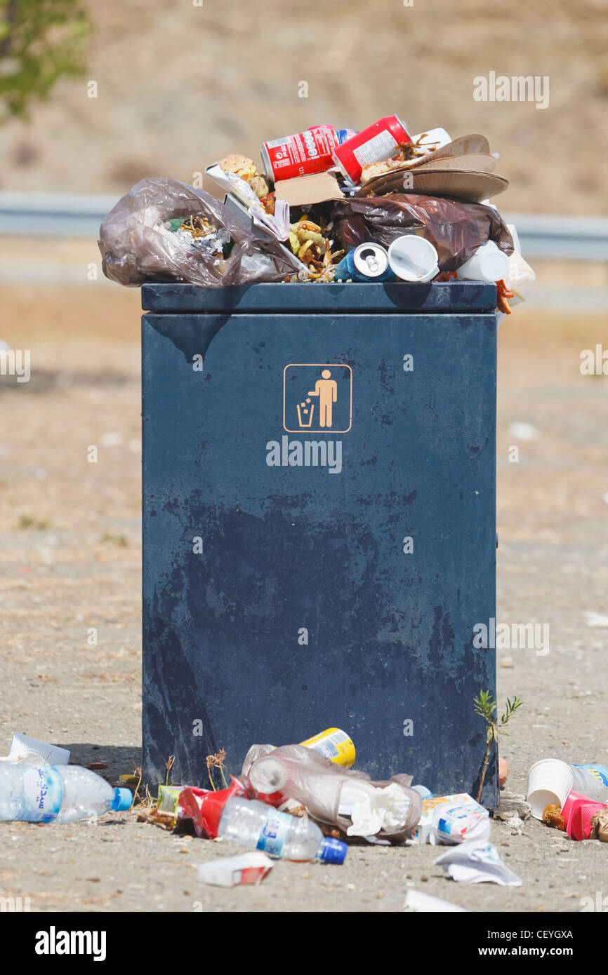 overflowing rubbish bin at a highway rest stop; malaga province spain Stock Photo