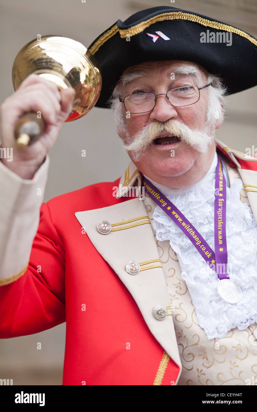 a traditional english town crier cryer in uniform Stock Photo Alamy