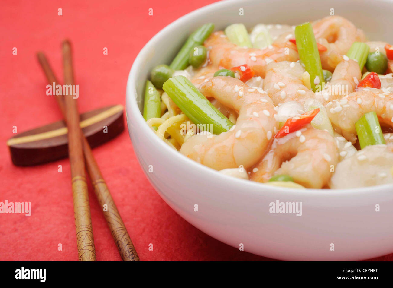 A bowl of stir fried prawns spring onion served egg noodles Prawn and