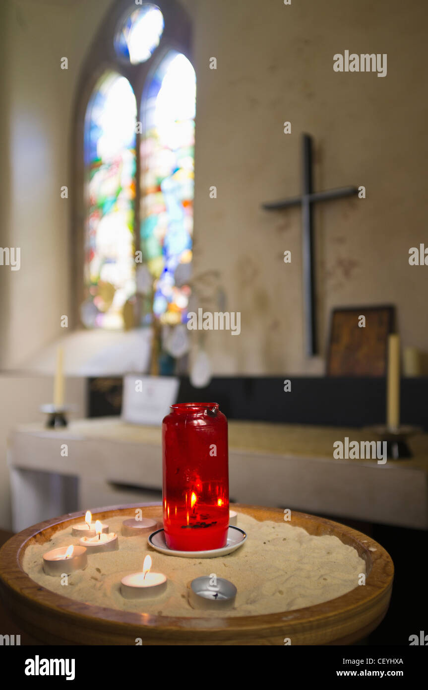 a table with candles at an altar in a church; northumberland england