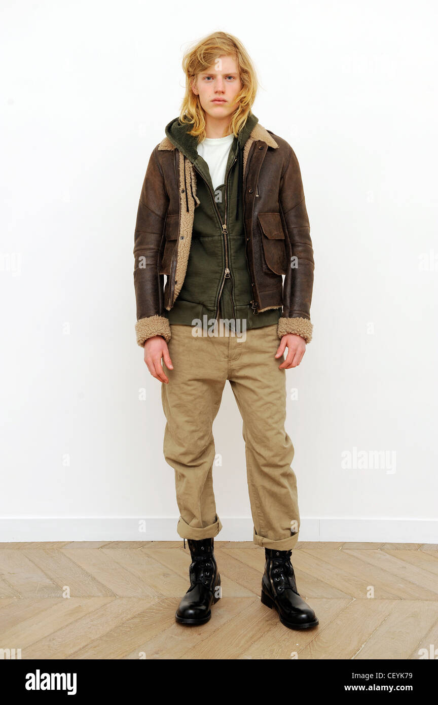 Balmain Paris Ready to Wear Menswear Autumn Winter White t shirt, green  hooded zipper top, brown sheepskin jacket, brown Stock Photo - Alamy