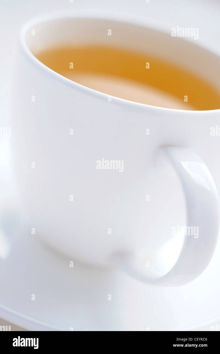 Download A Close Up Of A White Cup And Saucer Filled With A Yellow Fruit Tea Stock Photo Alamy Yellowimages Mockups