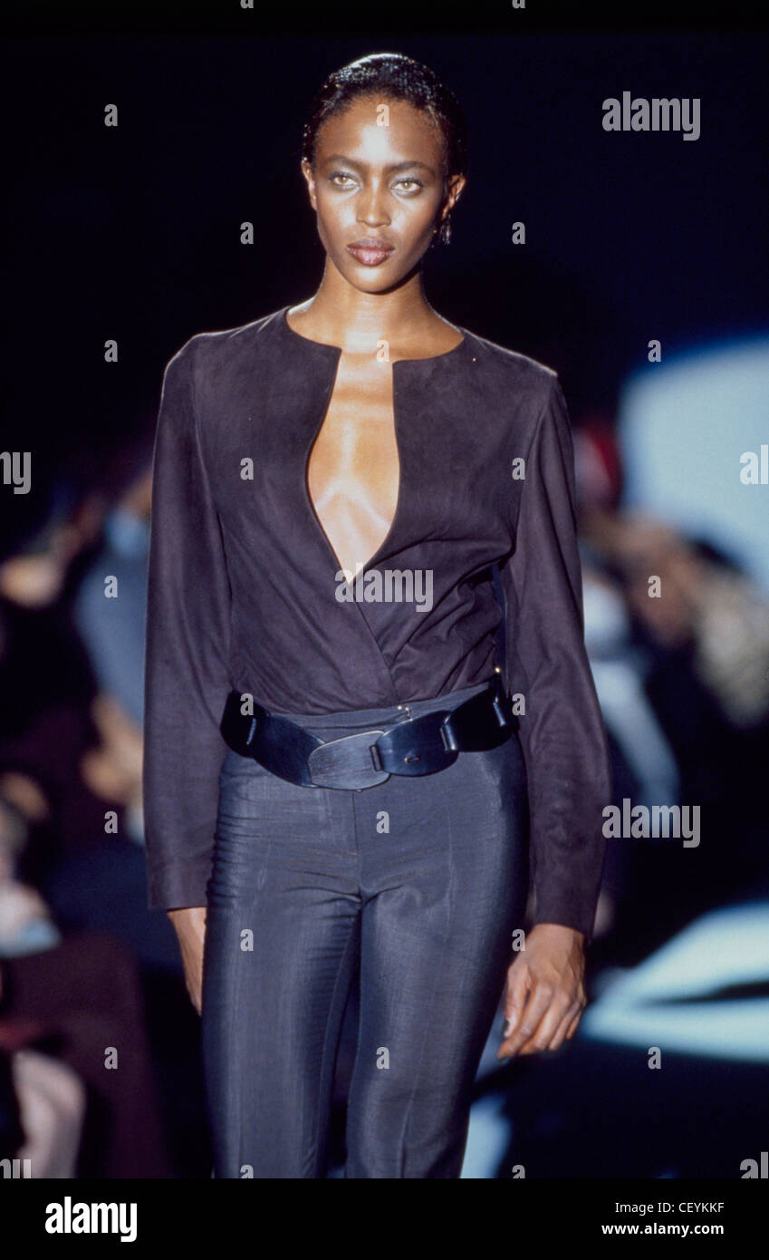 Gucci Milan Ready to Wear Spring Summer British model Naomi Campbell,  wearing a purple buttonless shirt, dark blue trousers and Stock Photo -  Alamy