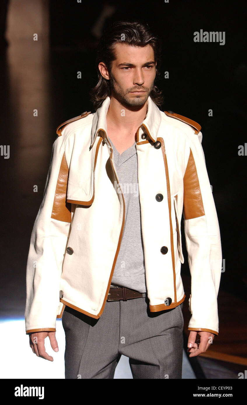 Gianfranco Ferre Milan Menswear S S Male wearing cream and brown leather jacket with black buttons Stock Photo