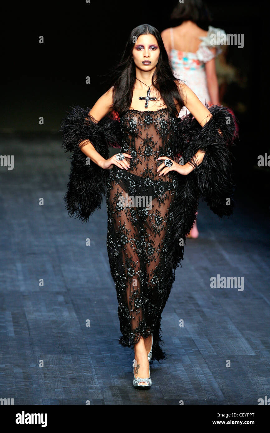 Mariella Burani Milan Ready to Wear Spring Summer Model dark makeup wearing  embroidered black sheer long strappy dress which Stock Photo - Alamy