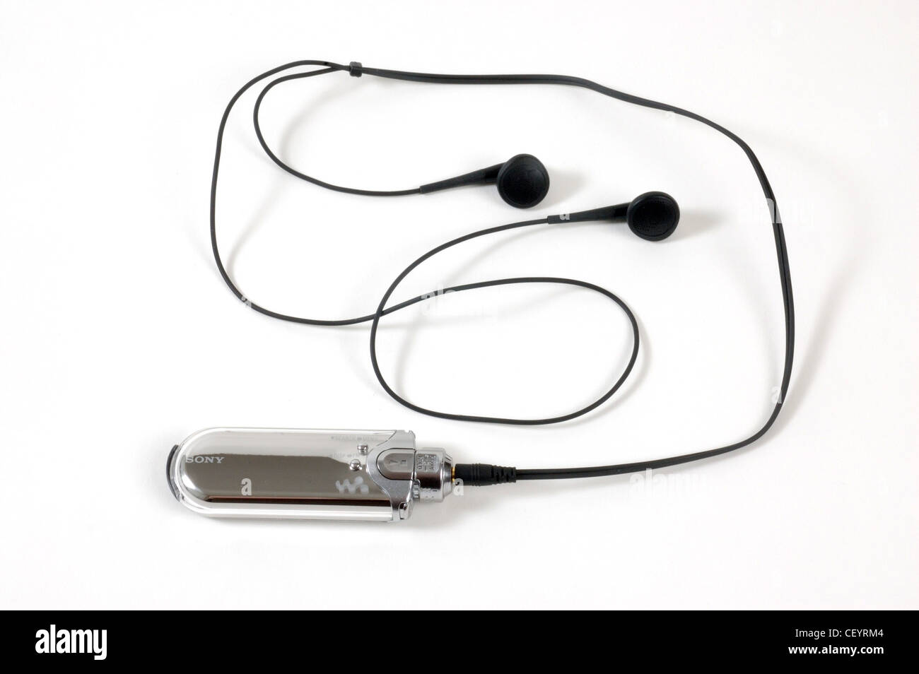 A small silver Sony MP3 player with in ear headphones attached Stock Photo  - Alamy