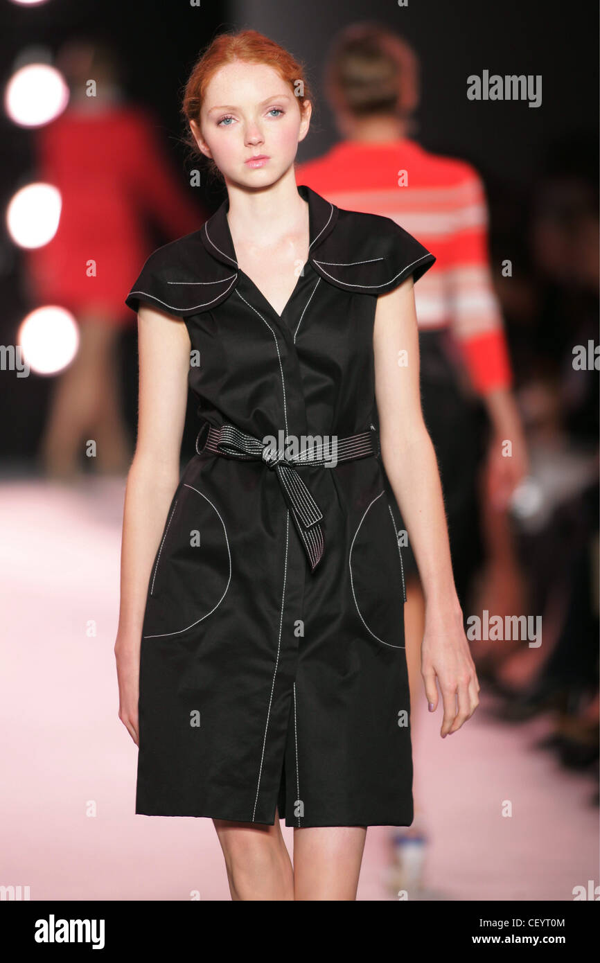 Nina Ricci Paris Ready to Wear S S Model Lily Cole red hair off face  wearing black silk cotton shirtdress short capped sleeves Stock Photo -  Alamy