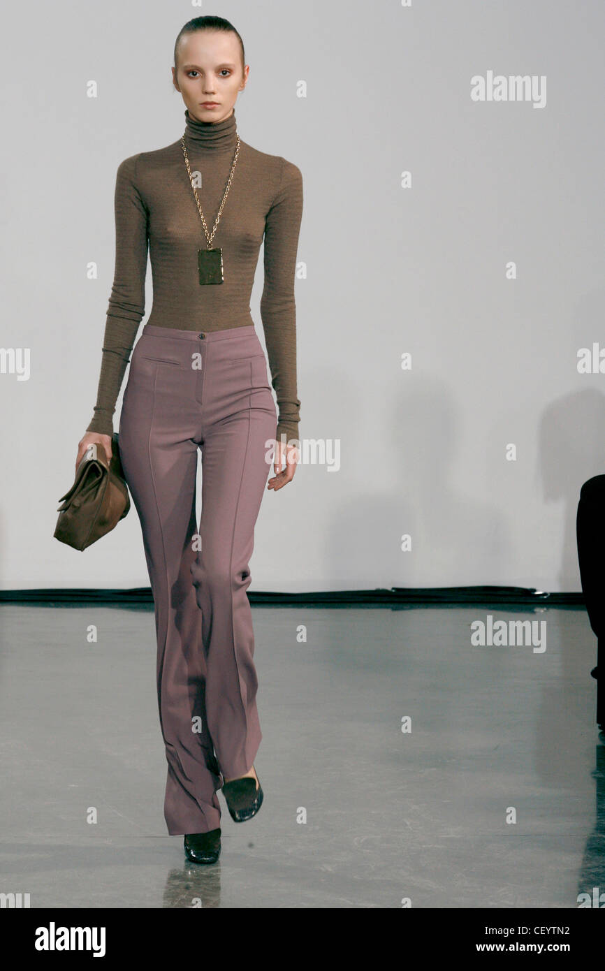 Halston New York Ready to Wear Autumn Winter See through brown polo neck  and high waisted lilac trousers Stock Photo - Alamy