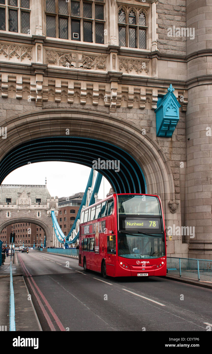 Red Bus Crossing Tower Bridge Stock Photo