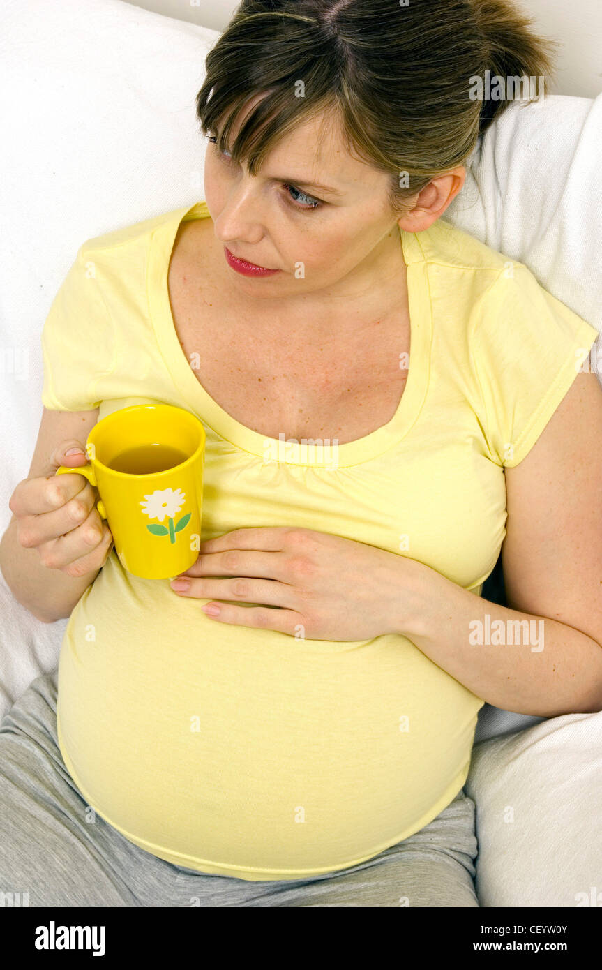 Pregnant Female drinking a cup of tea Stock Photo Alamy