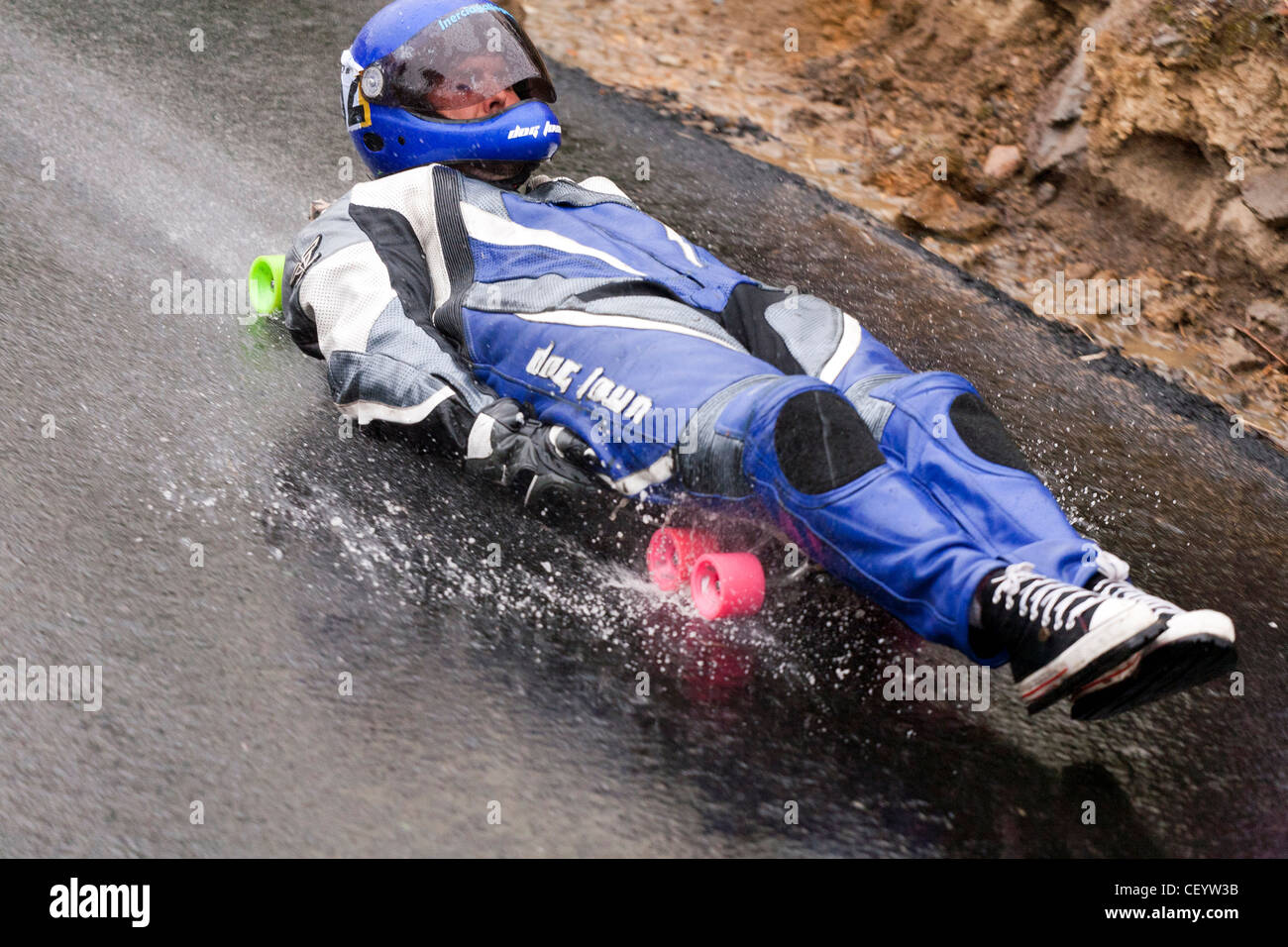 Pilot descending in a longboard in typical 'carrilanas' race in Galicia, Spain. Stock Photo