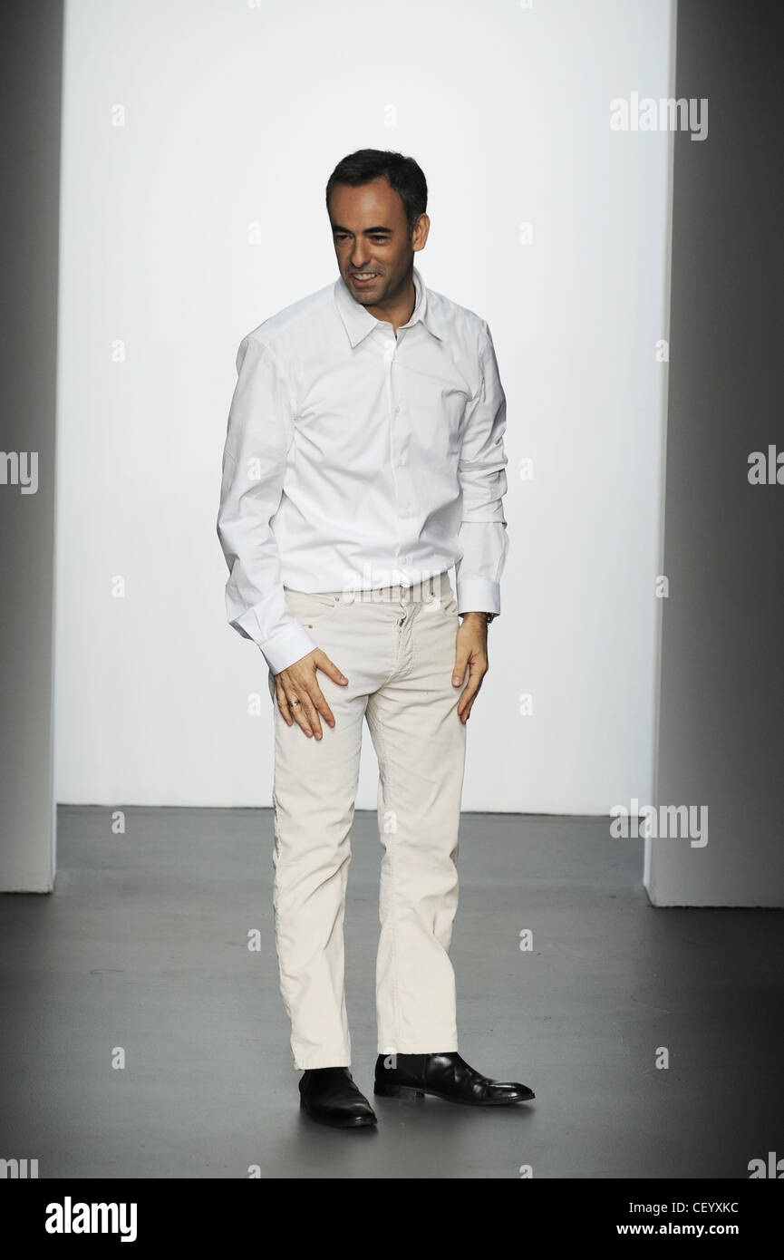 Calvin Klein New York Ready to Wear Autumn Winter Fashion designer Francisco Costa wearing a white shirt, off white trousers Stock Photo
