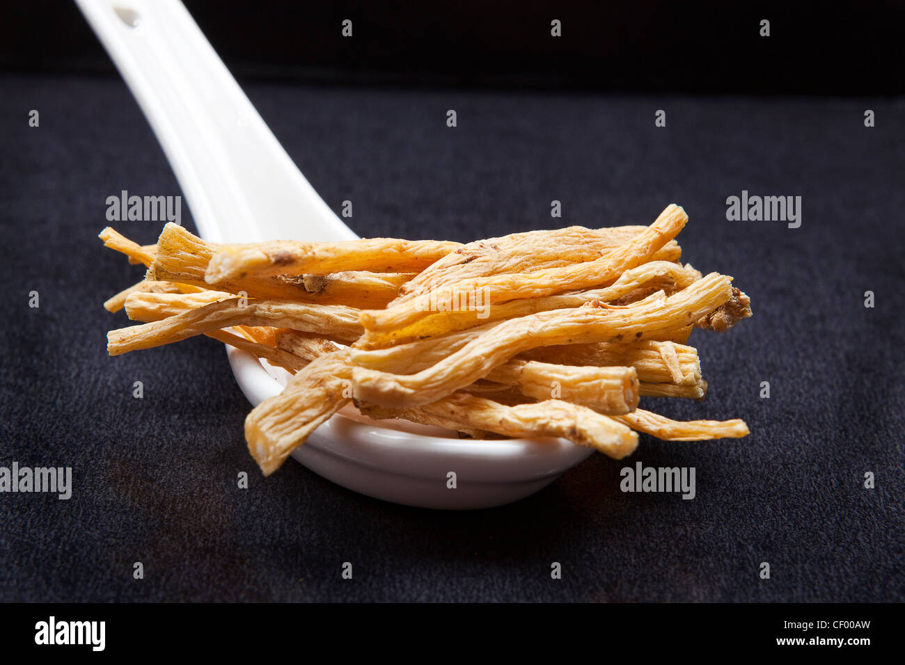 Dong Sum root on a white Chinese soup spoon Stock Photo