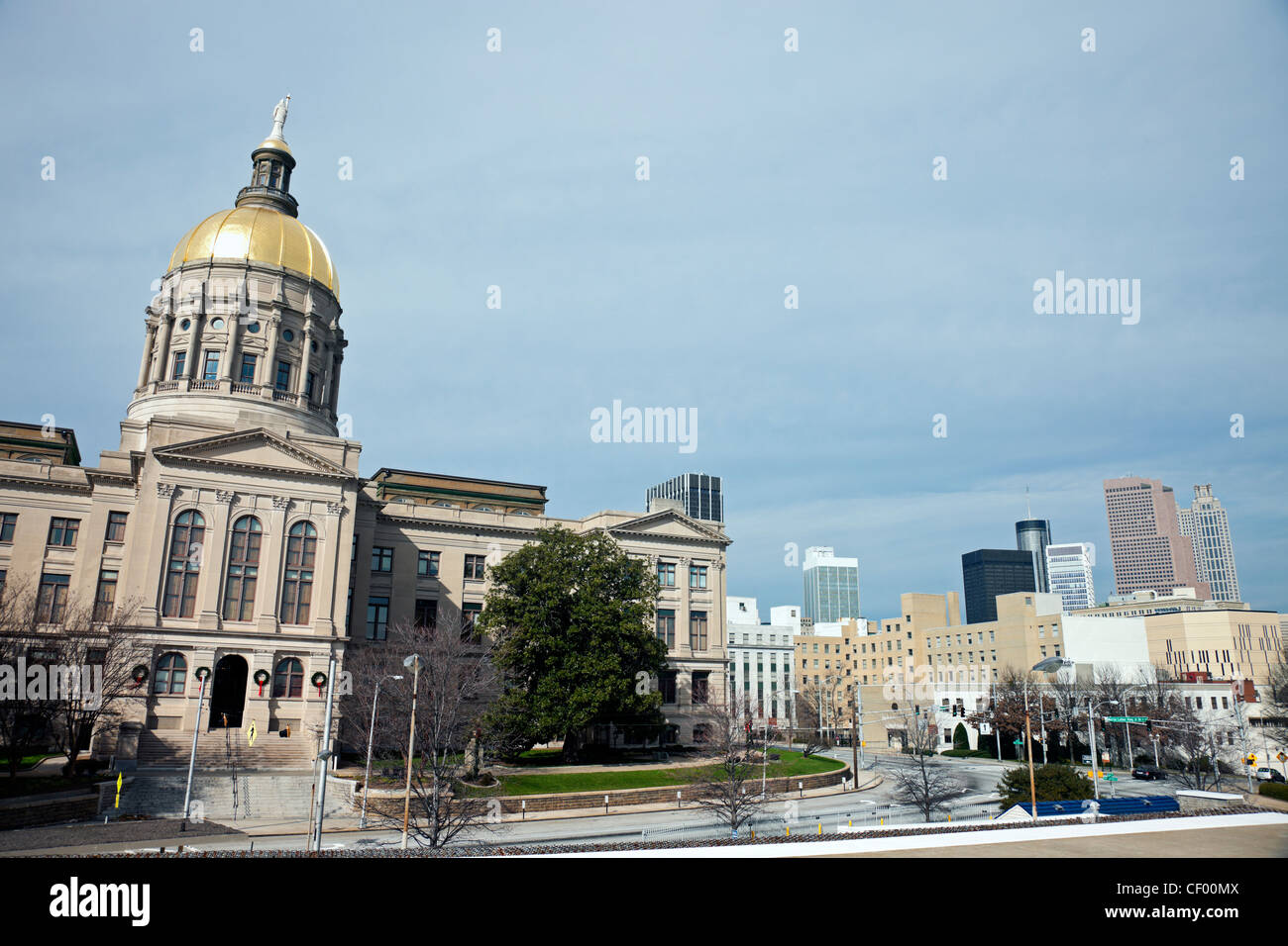 Atlanta, Georgia - State Capitol Building seen morning time with the downtown skyline on the right Stock Photo