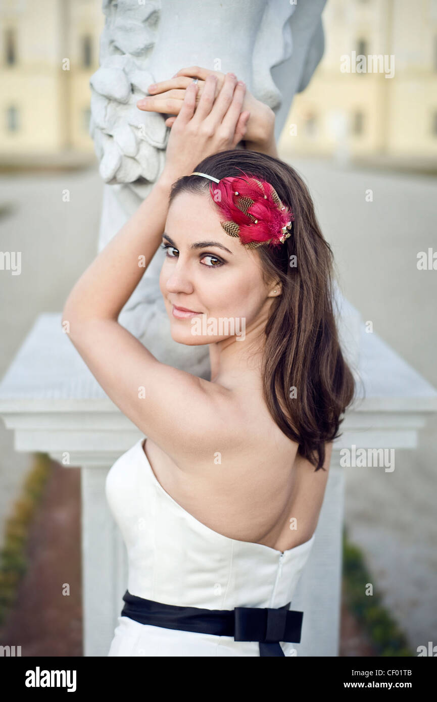 smiling brunette bride with fashionable stylish headpiece Stock Photo