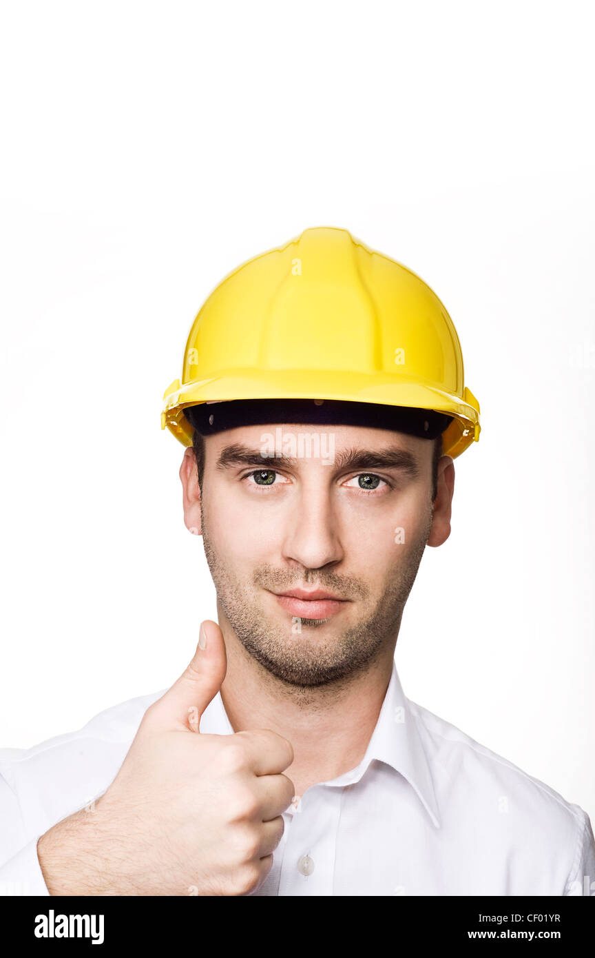 young male engineer with thumb up, over white background Stock Photo