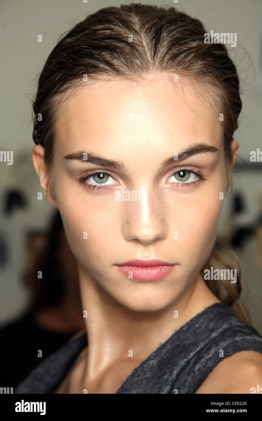 Calvin Klein Backstage Beauty New York Ready to Wear Spring Summer Head  shot of natural female with hair tied back Stock Photo - Alamy