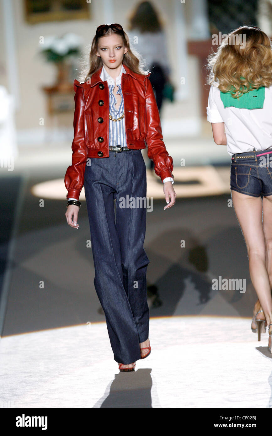 DSquared Milan Ready to Wear Spring Summer Red leather jacket over striped  blouse, and denim high waist flares Stock Photo - Alamy