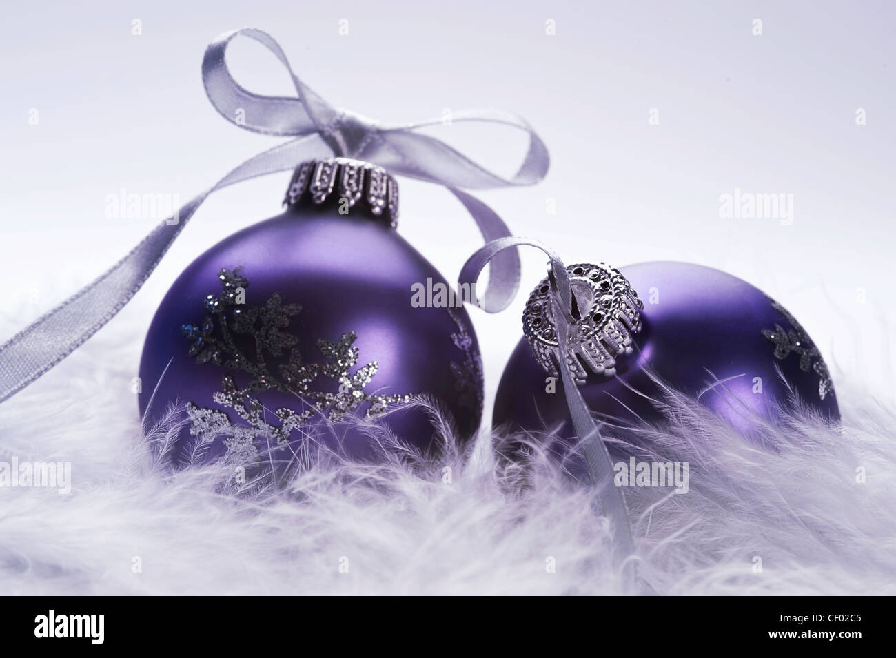 christmas balls with decorative silver ribbon on feather Stock Photo
