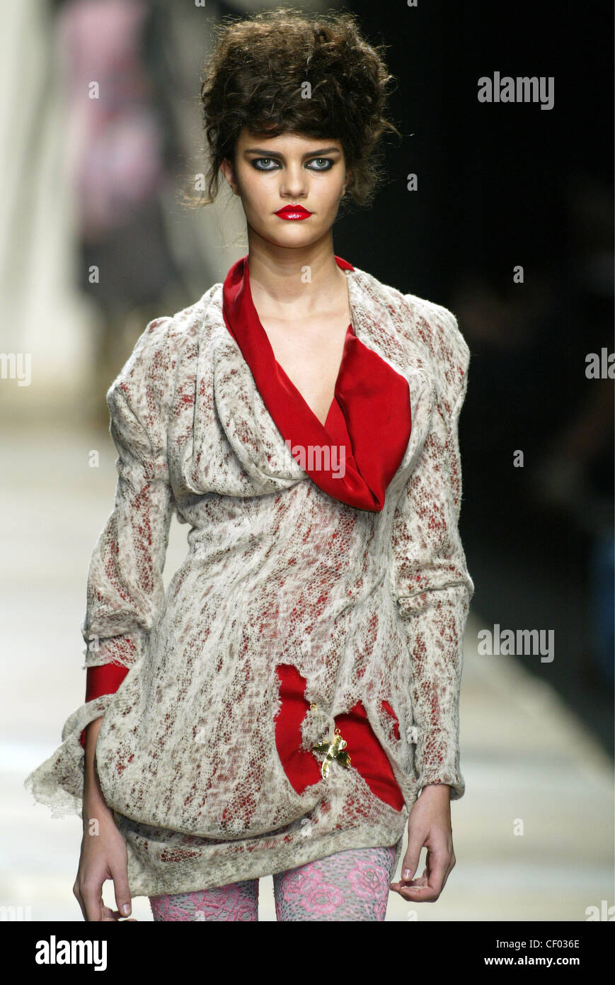 Vivienne Westwood Ready to Wear Paris A W Blonde female model her hair  piled on her head wearing a big puffy red dress huge Stock Photo - Alamy