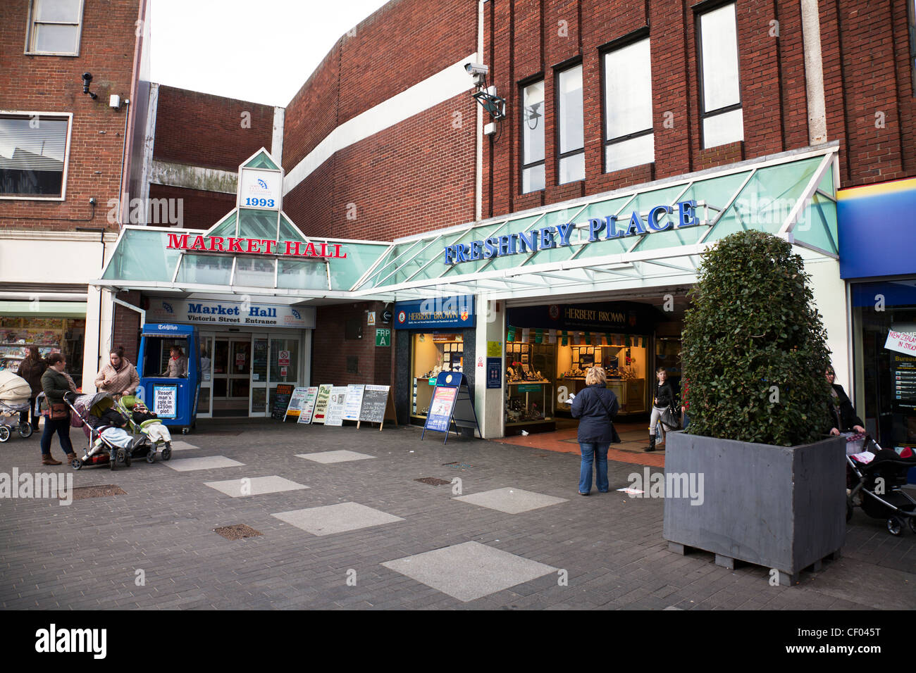 Grimsby Town, North Lincolnshire, England outside Fresney place shopping centre with shoppers with shopping Stock Photo