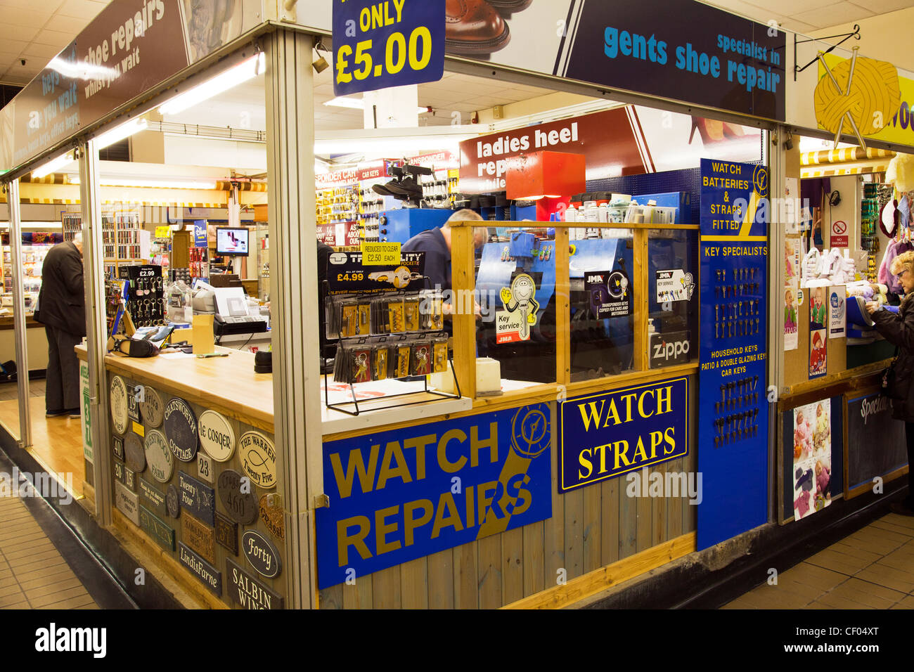 Grimsby Town, North Lincolnshire, England shoe repair stall in top town market hall inc key cutters Stock Photo