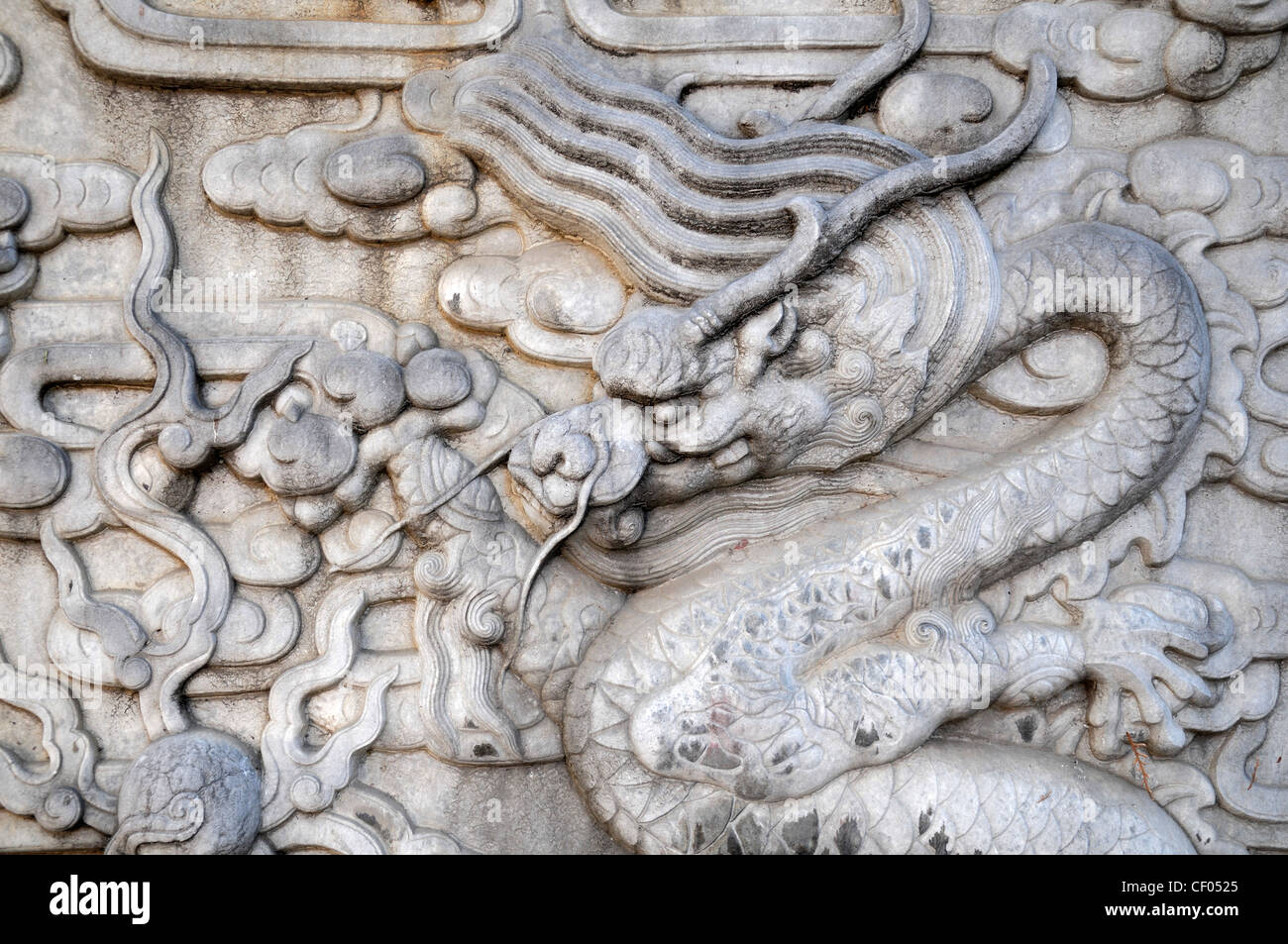 Intricate intricately carved carving stone slab bas relief Chinese Dragons Imperial Garden Forbidden City Beijing China Stock Photo