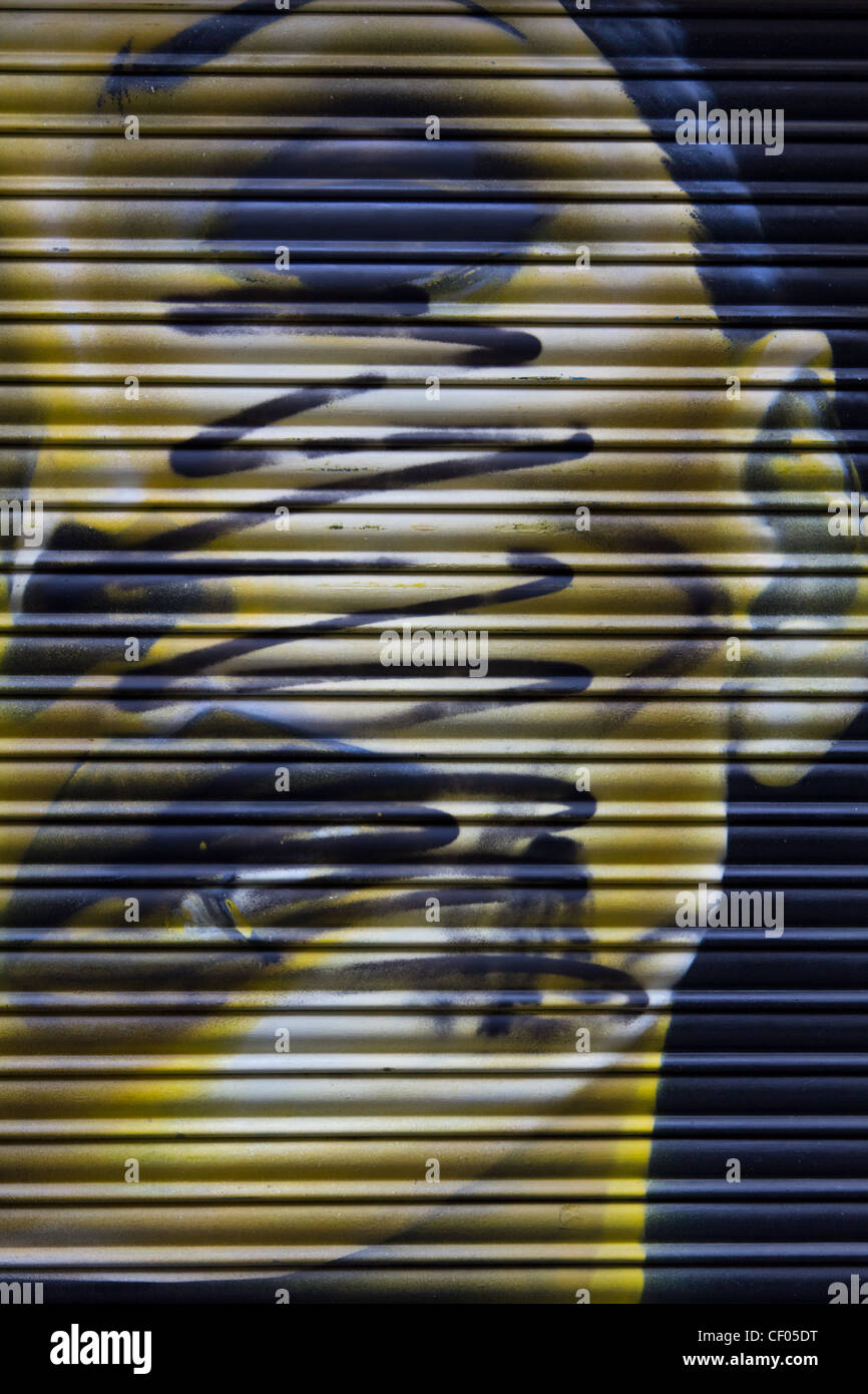 A graffiti on a garage in Madrid by an anonymous artist Stock Photo