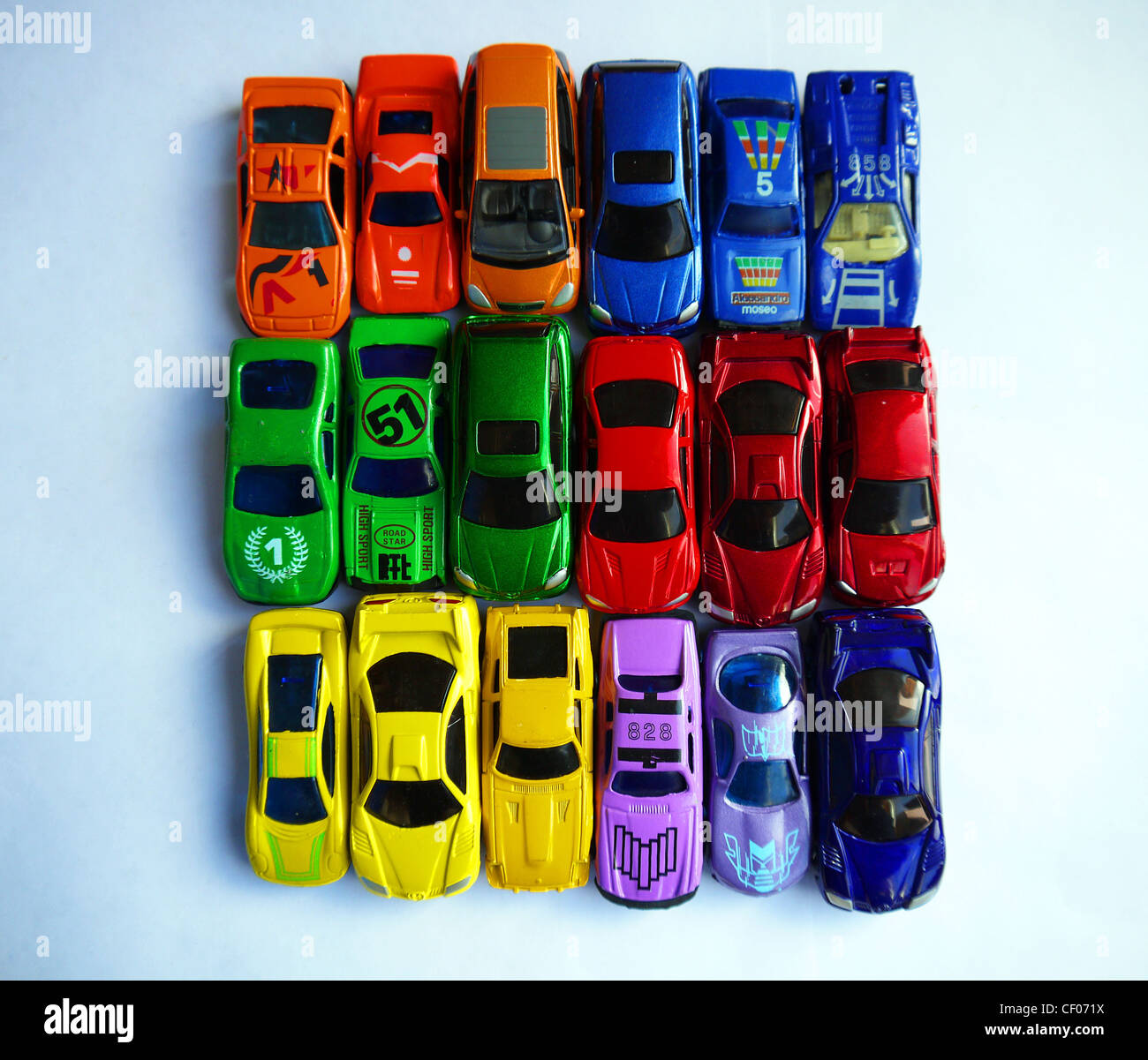 numerous toy cars arranged by colour Stock Photo
