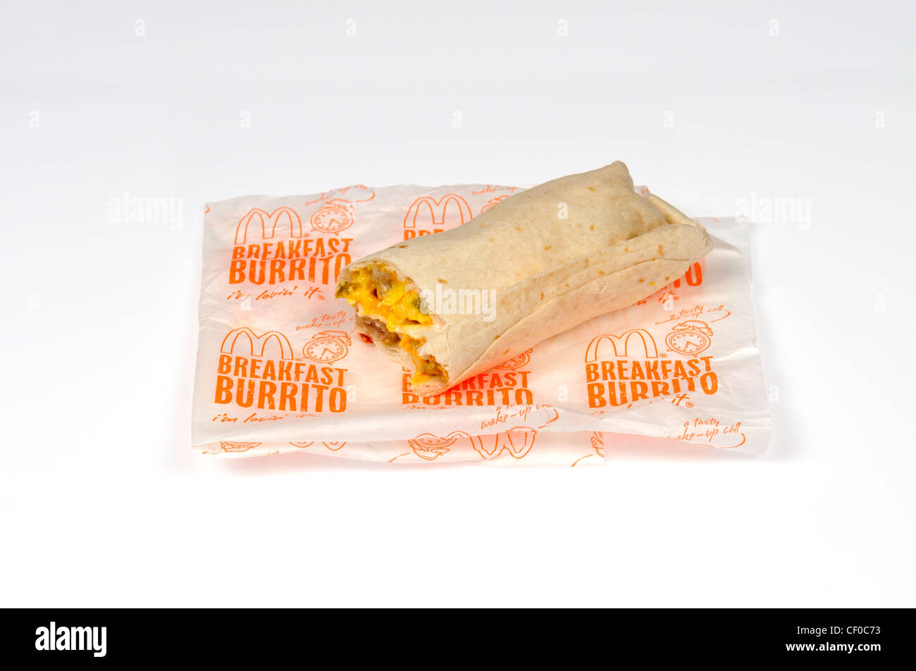 McDonald's sausage breakfast burrito with paper wrapper on white