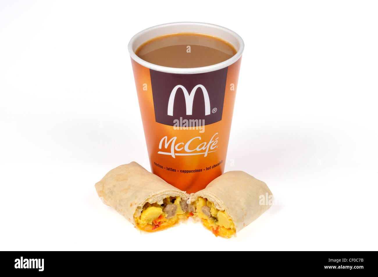 McDonalds breakfast burrito with eggs and sausage and cup of McCafe hot coffee on white cut out